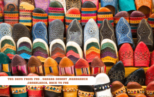 Merry Morocco tour card for Ten Days From Fes tour showing colorful Moroccan babouche leather slippers displayed in a market