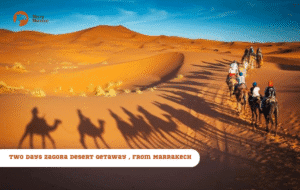 Merry Morocco tour card for Two Days Sahara Desert Getaway from Marrakech showing camel caravan walking through golden dunes