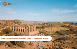 Merry Morocco Five Days Marrakech Desert Tour to Merzouga and Back tour card showing aerial Roman ruins at Volubilis
