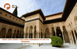 Merry Morocco tour card for Three Days Desert Tour from Marrakech to Fes showing a Moorish arched courtyard with ornate carved stonework